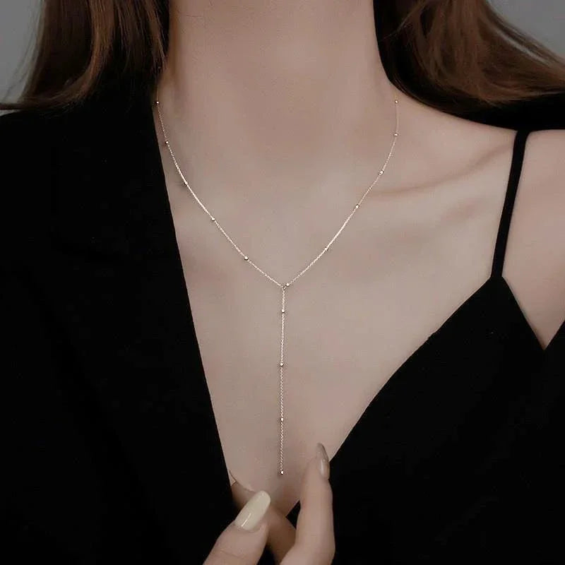 Collar Doble Capa Dorado con Cadena y Borlas